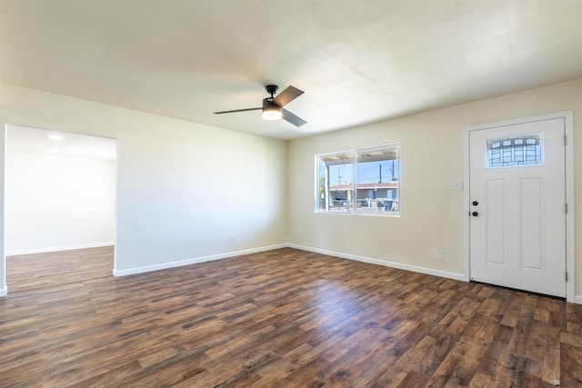 entryway featuring a ceiling fan, baseboards, and dark wood-style floors