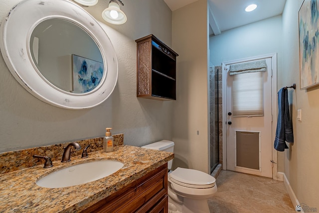 full bath with toilet, a shower stall, and vanity
