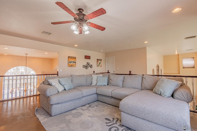 living area with a ceiling fan and recessed lighting