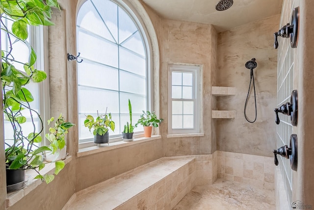 full bathroom with a tile shower