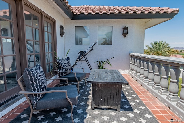 view of patio featuring a balcony