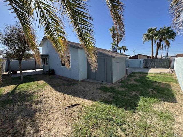 1971 E San Marcos Dr, Yuma, AZ 85364 - rear view of house with a fenced backyard and stucco siding