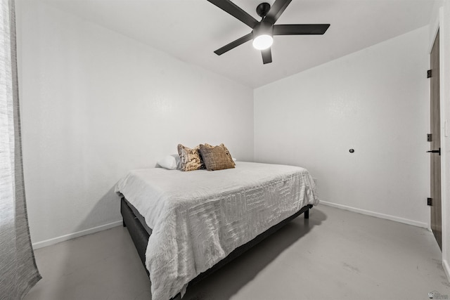 2045 S 14th Ave Unit 74, Yuma, AZ 85364 - bedroom with baseboards, a ceiling fan, and concrete floors