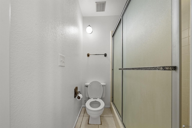 2045 S 14th Ave Unit 74, Yuma, AZ 85364 - full bathroom featuring tile patterned floors, a shower stall, toilet, and baseboards