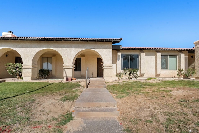 2045 S 14th Ave Unit 74, Yuma, AZ 85364 - mediterranean / spanish-style home featuring stucco siding and a front yard