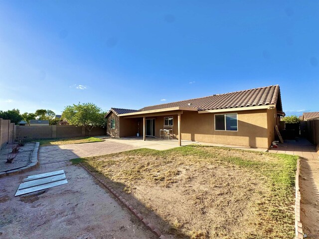 back of property featuring a patio area