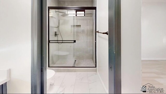 bathroom with toilet and walk in shower