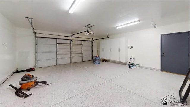 garage featuring a garage door opener