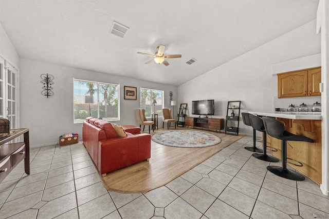 3875 W 26th St, Yuma, AZ 85364 - living area with lofted ceiling, a ceiling fan, and light tile patterned flooring