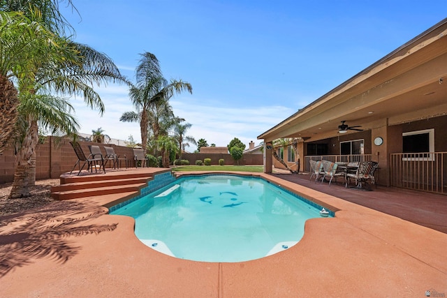3875 W 26th St, Yuma, AZ 85364 - view of swimming pool featuring outdoor dining space, ceiling fan, a fenced backyard, and a patio area