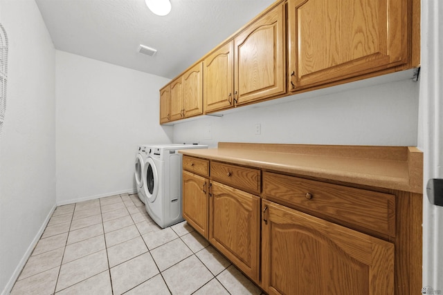 3875 W 26th St, Yuma, AZ 85364 - laundry room featuring separate washer and dryer, cabinet space, and light tile patterned floors