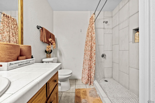 3875 W 26th St, Yuma, AZ 85364 - bathroom featuring vanity, tile patterned flooring, and a stall shower