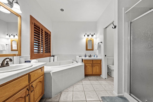 3875 W 26th St, Yuma, AZ 85364 - full bath with two vanities, a stall shower, tile patterned flooring, and a garden tub