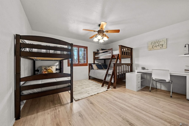 3875 W 26th St, Yuma, AZ 85364 - bedroom with wood finished floors, a desk, and a ceiling fan