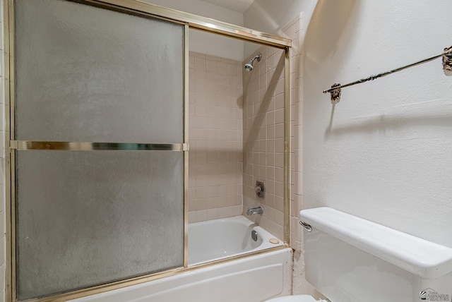 2231 S Elks Ln # 77, Yuma, AZ 85364 - full bathroom with toilet, shower / bath combination with glass door, and a textured wall