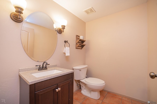 bathroom with visible vents, tile patterned flooring, vanity, toilet, and baseboards