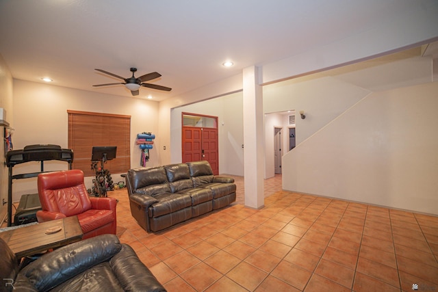 living area with light tile patterned floors, a fireplace, a ceiling fan, and recessed lighting