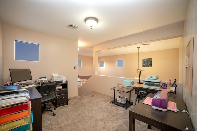 carpeted office space with visible vents