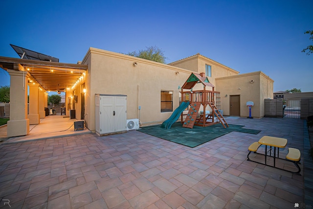 exterior space with a patio, fence, and ac unit