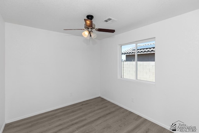 4804 W 10th Pl, Yuma, AZ 85364 - unfurnished room featuring wood finished floors and ceiling fan