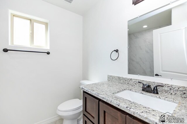 12653 E 51st Pl, Yuma, AZ 85367 - bathroom with vanity, toilet, and visible vents