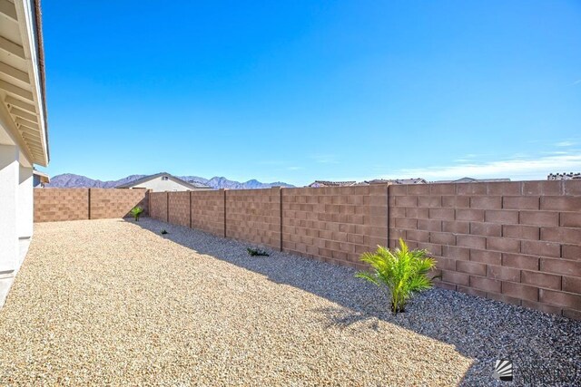12653 E 51st Pl, Yuma, AZ 85367 - view of yard with a fenced backyard and a mountain view