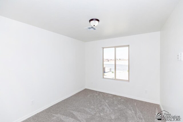 12653 E 51st Pl, Yuma, AZ 85367 - unfurnished room with baseboards, carpet flooring, and visible vents