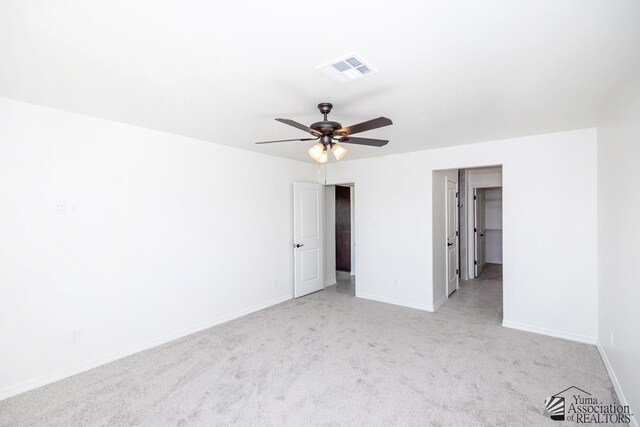 12653 E 51st Pl, Yuma, AZ 85367 - unfurnished bedroom featuring visible vents, carpet, a walk in closet, and baseboards