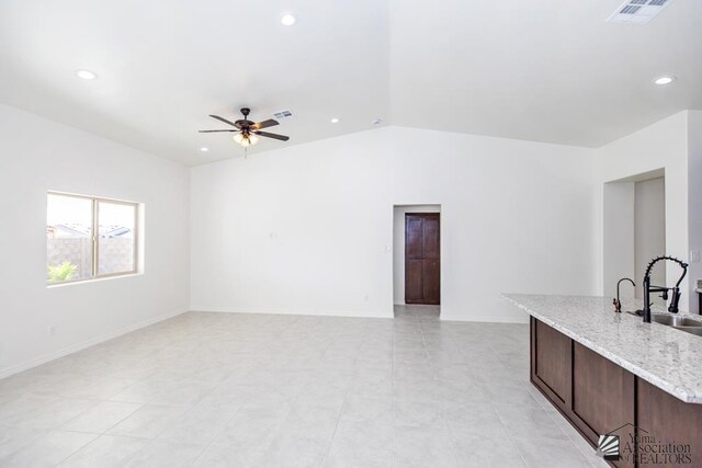 12653 E 51st Pl, Yuma, AZ 85367 - unfurnished living room with visible vents, a ceiling fan, a sink, and recessed lighting