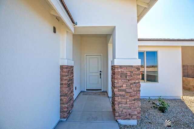 12653 E 51st Pl, Yuma, AZ 85367 - view of exterior entry with stucco siding