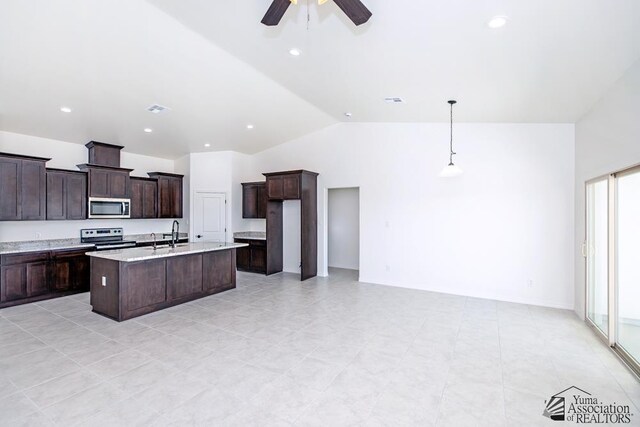 12653 E 51st Pl, Yuma, AZ 85367 - kitchen featuring visible vents, appliances with stainless steel finishes, vaulted ceiling, and dark brown cabinets