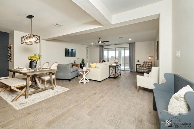 12160 S Drucilla Ln, Yuma, AZ 85367 - living room featuring light wood-style flooring, a ceiling fan, recessed lighting, and beamed ceiling