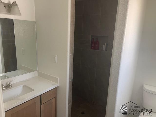 4680 E San Pedro St, San Luis, AZ 85336 - bathroom with vanity, toilet, and tiled shower