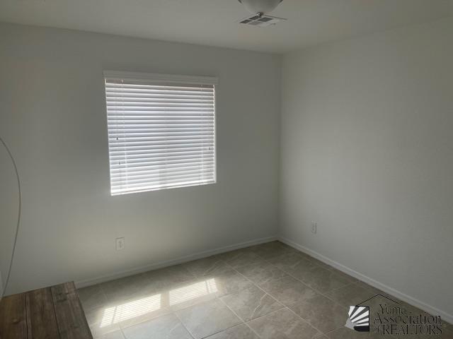 4680 E San Pedro St, San Luis, AZ 85336 - tiled empty room with baseboards and visible vents