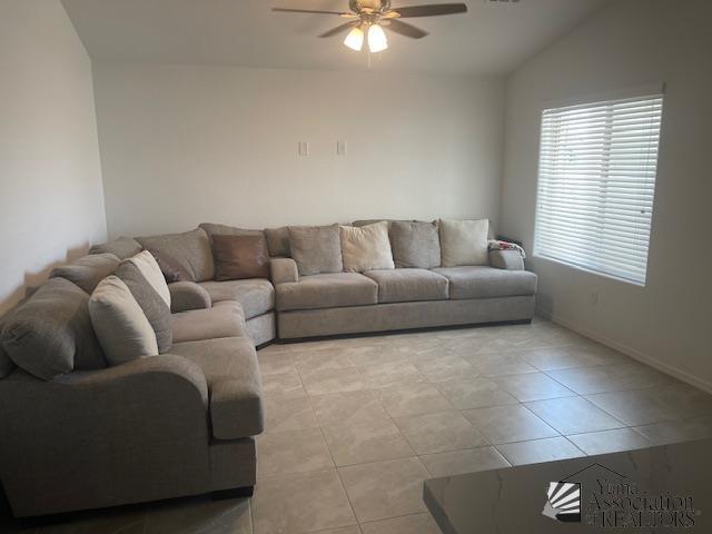 4680 E San Pedro St, San Luis, AZ 85336 - living room featuring a ceiling fan, light tile patterned floors, and vaulted ceiling