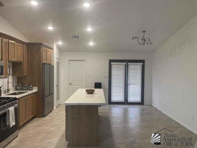 4680 E San Pedro St, San Luis, AZ 85336 - kitchen with recessed lighting, a center island, visible vents, a sink, and stainless steel appliances