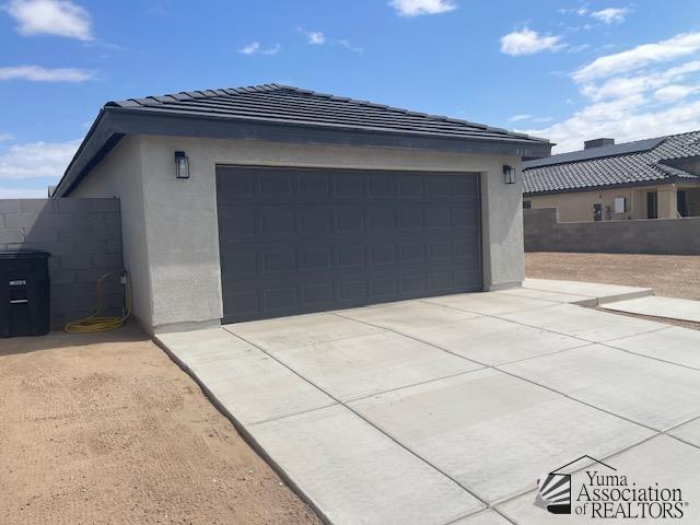 4680 E San Pedro St, San Luis, AZ 85336 - garage featuring driveway and fence