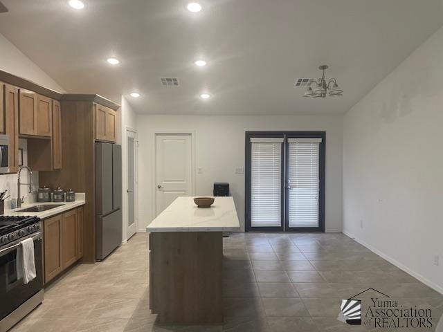 4680 E San Pedro St, San Luis, AZ 85336 - kitchen with recessed lighting, a center island, visible vents, a sink, and stainless steel appliances