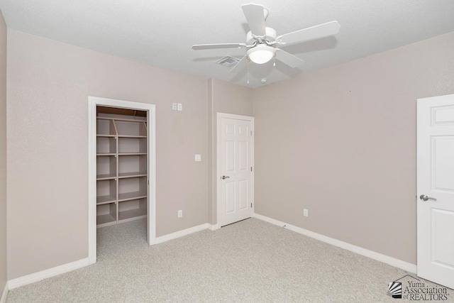5492 E View Pkwy, Yuma, AZ 85365 - unfurnished bedroom featuring a spacious closet, light colored carpet, baseboards, ceiling fan, and a closet