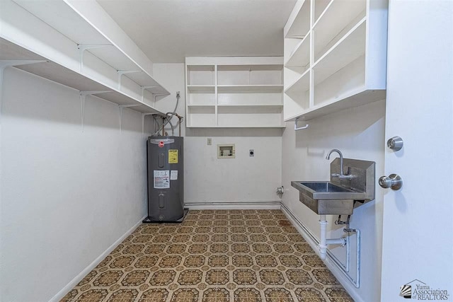 laundry area with water heater, hookup for a washing machine, hookup for an electric dryer, and sink