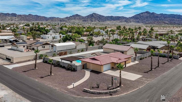 birds eye view of property featuring a mountain view