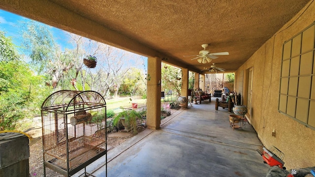 view of patio featuring ceiling fan