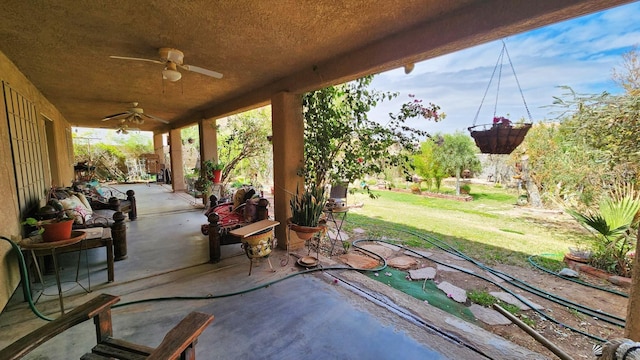view of patio featuring ceiling fan