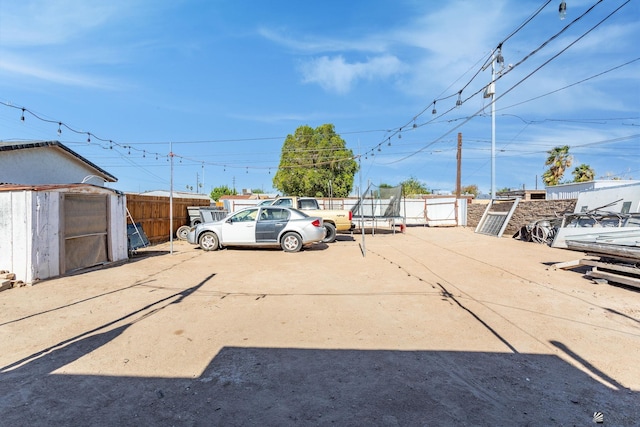 1127 S 13th Ave, Yuma, AZ 85364 - view of car parking with a trampoline