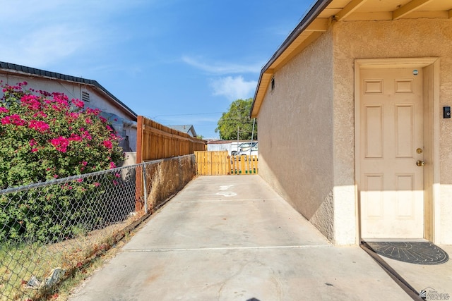 1127 S 13th Ave, Yuma, AZ 85364 - view of side of property with stucco siding and a patio area