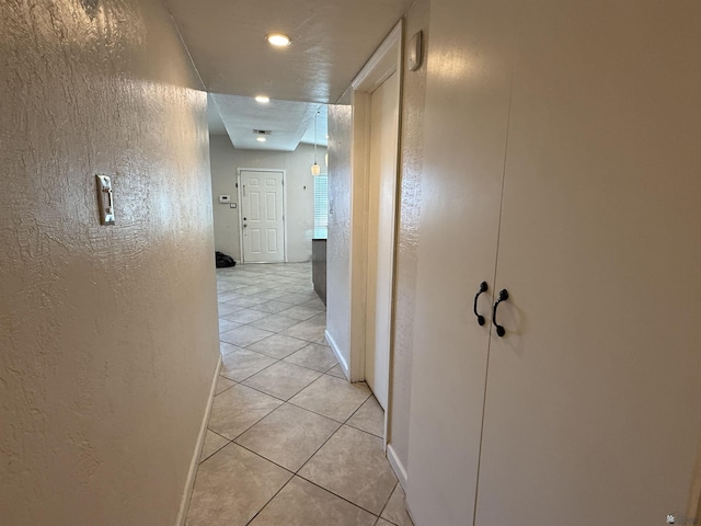 2741 S Fern Dr, Yuma, AZ 85364 - hallway with a textured wall, light tile patterned floors, and recessed lighting