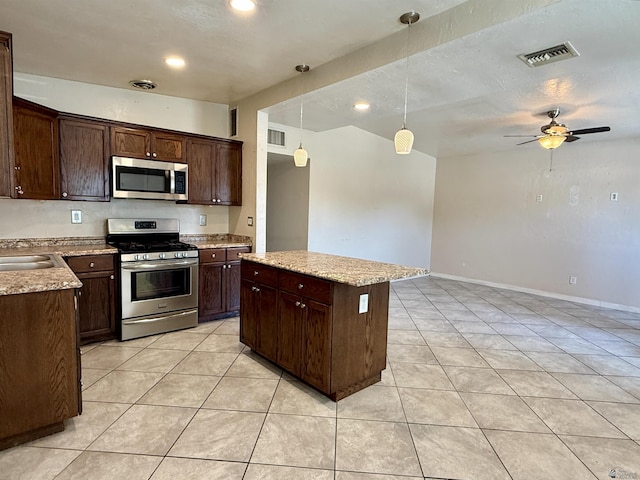 2741 S Fern Dr, Yuma, AZ 85364 - kitchen featuring stainless steel appliances, dark brown cabinetry, light tile patterned flooring, a ceiling fan, and recessed lighting