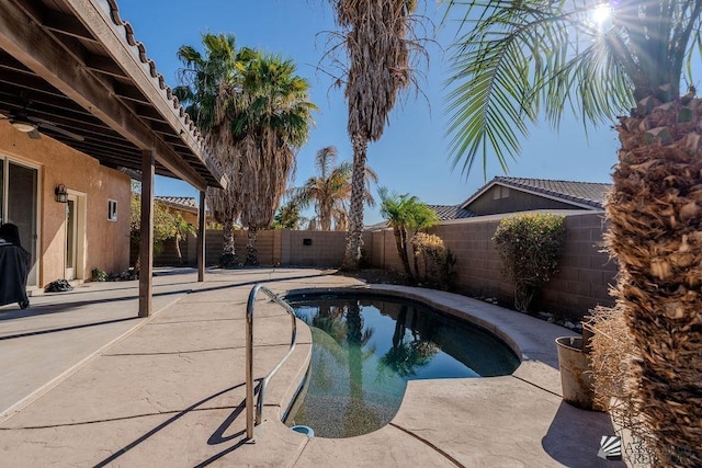 view of pool featuring a fenced backyard, a fenced in pool, and a patio