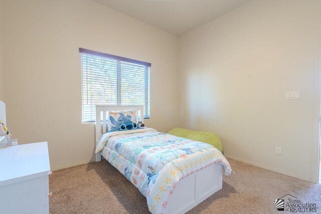 carpeted bedroom with baseboards