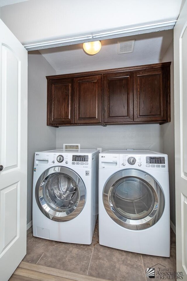 6257 E 47th St, Yuma, AZ 85365 - washroom featuring washing machine and dryer and cabinet space